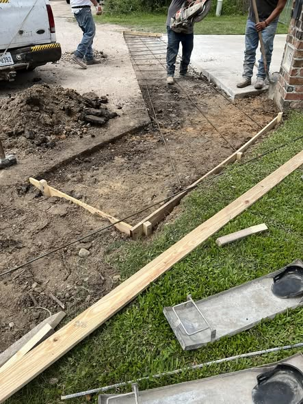 Before: excavated concrete strip with wooden forms and steel reinforcement